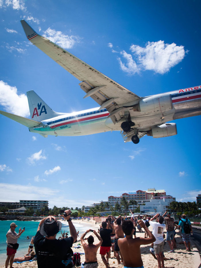 america airlines jet above maho beach